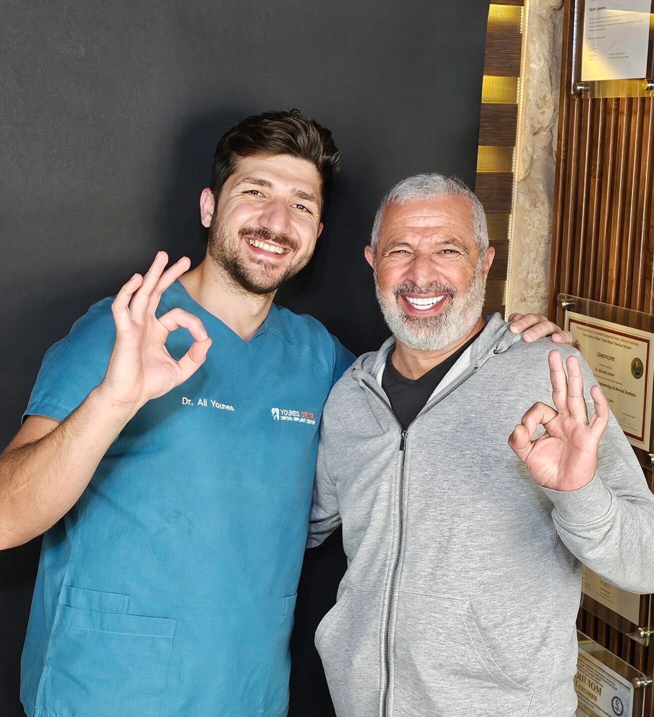 Dr Ali Younes with a patient after treatment